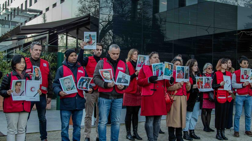 IFRC staff and volunteers from the Geneva Red Cross hold photos of volunteers killed in the line of duty this year. As of 5 December, 32 Red Cross and Red Crescent Staff and volunteers have been killed in the line of duty in 2024.