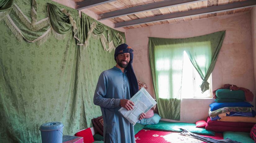 A 35-year-old resident of Gulran District, Herat, in a new shelter built by local workers and volunteers through a collaboration between the IFRC, the Afghan Red Crescent and other partners.