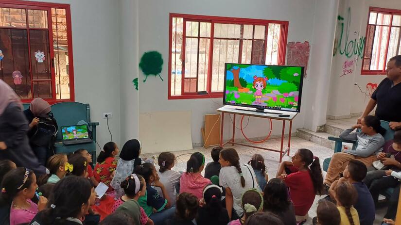 Children gather for a session organized by the Palestine Red Crescent to bring some joy and normalcy amid the stresses of conflict. The impact of displacement, physical hardship, and the constant fear has had devastating consequences on children’s mental health.