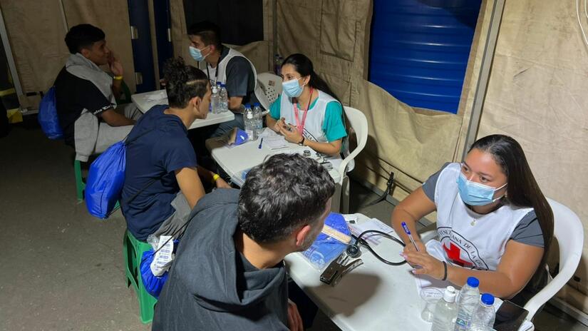 Staff and volunteers for the Venezuelan Red Cross provide health check ups and other humanitarian assistance to Venezuelan migrants who have recently been returned to the country.