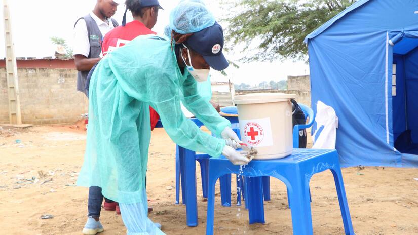 Angola Red Cross volunteers use safe drinking water to make oral re-hydration solution for people with cholera. People with cholera often suffer from acute dehydration.