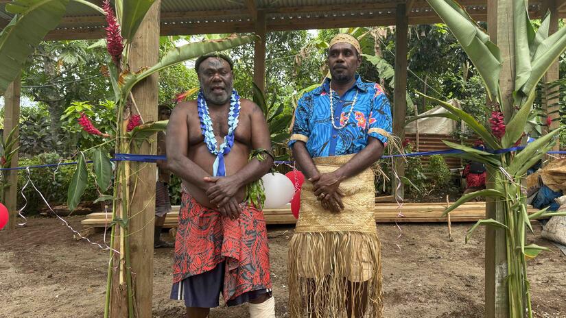 Britano chairman Andrew Nayo and chief George John pose by the newly constructed evacuation centre.jpg