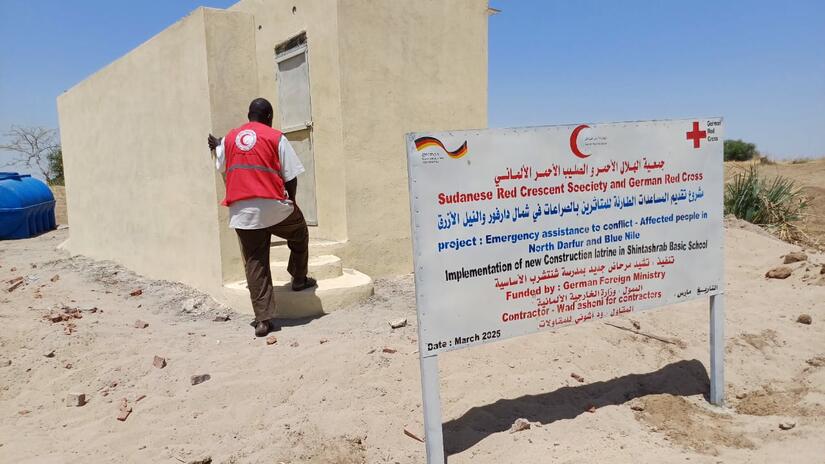 Sudanese Red Crescent personnel inspect latrines recently Installed in Blue Nile state in cooperation with the German Red Cross.