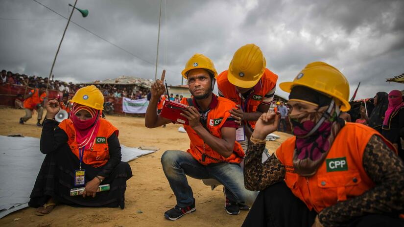 In the sprawling refugee camps in Cox’s Bazar in Bangladesh, volunteers like these from the camp community take the lead in preparing and alerting people to coming storms and other potential emergencies.