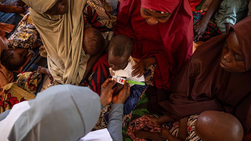 Red Cross team member Jamilia, 39, shares vital health tips with new and expectant mothers in PHC, Gumbi.