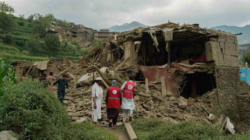 Afghan Red Crescent volunteers join local residents in search for survivors and providing life-saving first aid.