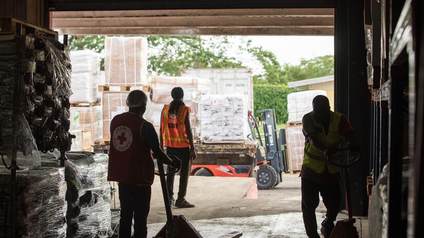 A shipment of 50 tons of humanitarian aid being unloaded into the warehouse at the Jamaica Red Cross Headquarters in Central Village, St Catherine.
