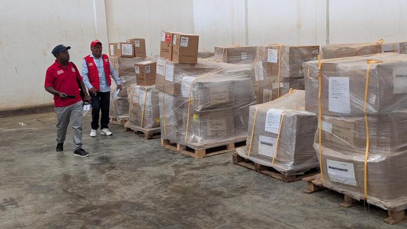 A critical IFRC shipment of Safe and Dignified Burial (SDB) kits and body bags are reviewed after their arrival in Bunia, an area hard hit by the evolving Ebola Virus Disease outbreak in the Democratic Republic of the Congo.