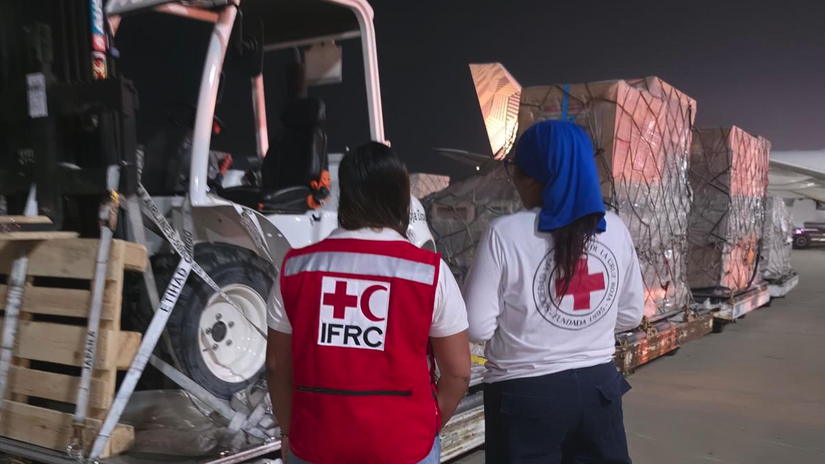 Staff members from the IFRC and the Venezuelan Red Cross oversee the arrival of materials for an emergency field hospital, dispatched by the IFRC in partnership with the Spanish Red Cross.
