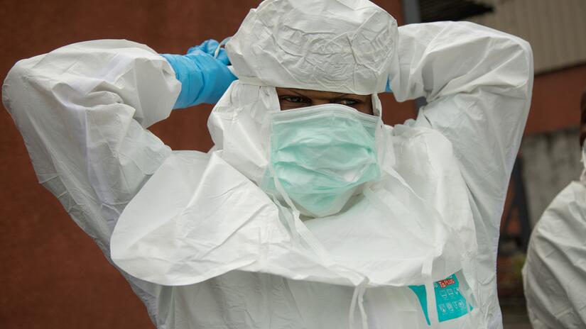 Gomas safe and dignified burial team (SDB) at one of Gomas hospital morgues where a woman of 35 died of unexplanable symptomes. The team responds to alerts of suspected ebola deaths and of all unident