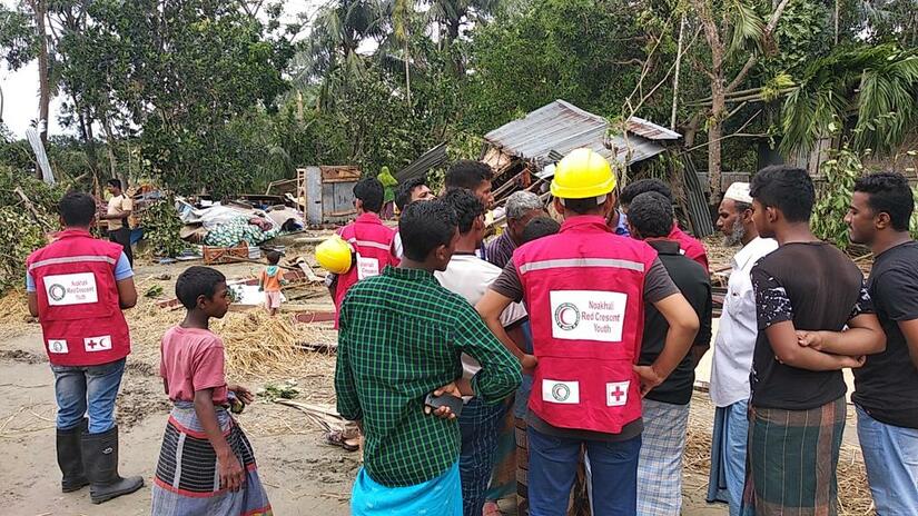 Bangladesh Red Crescent volunteers assessing damage in affected communities.