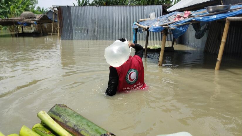 Bangladesh, Tangail, 15 Jul 2020.Bangladesh Red Crescent volunteers reaching stranded families with drinking water and other support after monsoon floods affected almost one-third of the country.