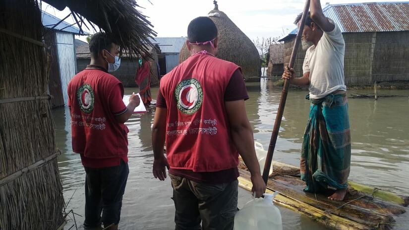 Bangladesh, Kurigram, 16 July 2020.Bangladesh Red Crescent Society volunteers reaching affected communities with drinking water and other support after monsoon floods affected more than one-third of t