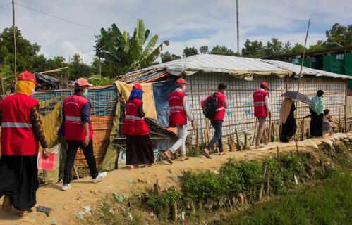 In Cox's Bazar, Bangladesh Red Crescent Society volunteers, with support from the IFRC and partners, conduct door-to-door health visits during the COVID-19 pandemic.