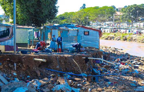 People in KwaZulu-Natal province, South Africa inspect damage to their house caused by devastating flooding that hit the region in April 2022