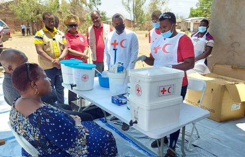 Malawi Red Cross volunteers educate members of their local community about cholera risks and how they can access treatment and care amid a country-wide outbreak in 2022