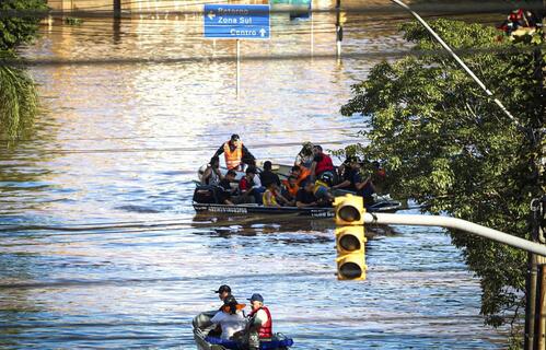 Emergency response workers use boats to rescue people stranded by floods in Rio Grande do Sol state in Brazil. 