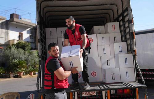 Lebanese Red Cross volunteers prepare humanitarian aid in the city of Aley. They store food parcels, mattresses and others goods in local warehouses so they can be distributed to displaced people.