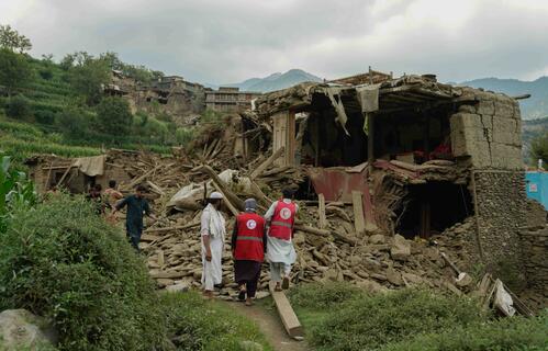 Afghan Red Crescent volunteers join local residents in search for survivors and providing life-saving first aid.