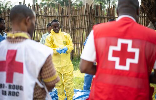 Volunteer with the DRC Red Cross learns how to put on protective equipment to conduct safe and dignified burials in his community, Mbandaka,