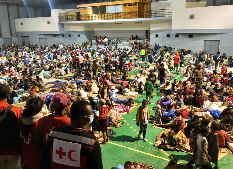 Malagasy Red Cross volunteers provide relief items and services to thousands of people in a temporary accommodation centre set up in January 2022 to help people affected by torrential rains, Tropical Storm Ana and Cyclone Batsirai.