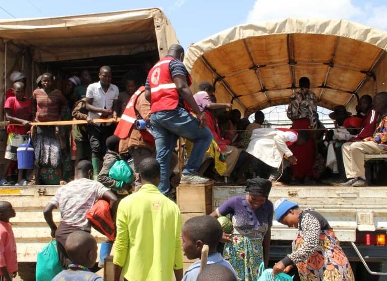 People fleeing violence in the Democratic Republic of the Congo are received at the Bunagana border point in Uganda where refugees receive support from the Uganda Red Cross Society