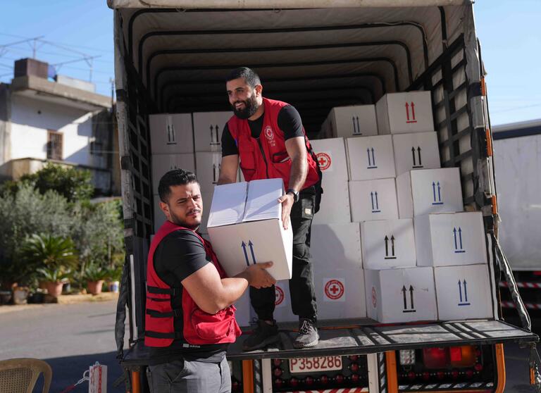  Lebanese Red Cross volunteers prepare humanitarian aid in the city of Aley. They store food parcels, mattresses and others goods in local warehouses so they can be distributed to displaced people.