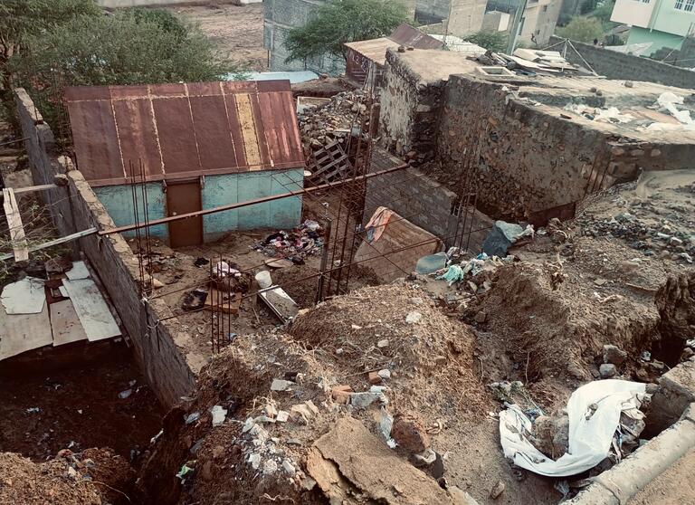 Sections of an urban neighborhoods washed away by severe flooding on the night of 10 August.