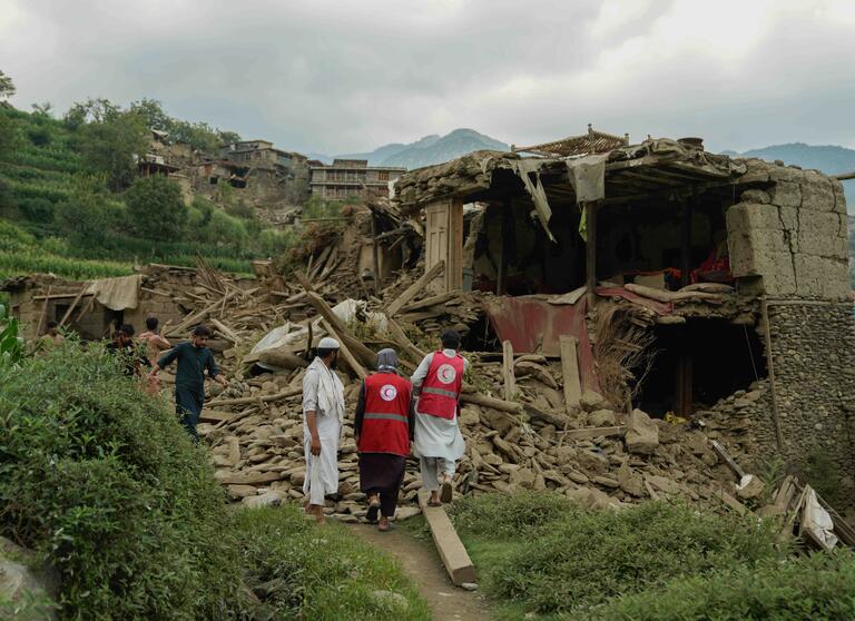 Afghan Red Crescent volunteers join local residents in search for survivors and providing life-saving first aid.