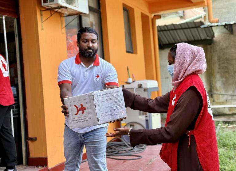 Teams from the Sri Lanka Red Cross Society’s Gampaha Branch prepare relief supplies for families following devastating floods caused by Tropical Cyclone Ditwah.