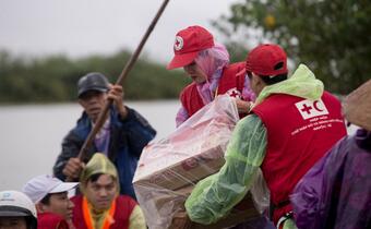 Viet Nam Red Cross Society volunteers help relocate and provide emergency assistance to communities affected by Typhoon Molave in October 2020