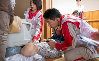 Japanese Red Cross medical teams provide medical support in evacuation centres to people affected by Typhoon Hagibis