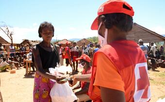 Volunteers from Madagascar Red Cross distribute cash assistance to communities affected by drought and food insecurity in the south of the country to help them feed their families