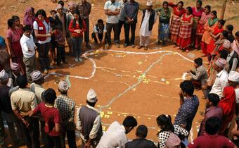 Nepal Red Cross and Danish Red Cross volunteers team up to lead a vulnerability and capacity assessment with a village community in Kavre district, Nepal
