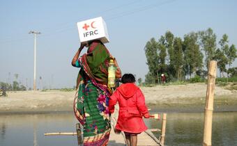 The Bangladesh Red Crescent Society distributes hygiene and food parcels to communities affected by flooding in 2020.