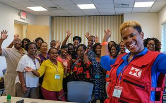 Volunteers from the Bahamas Red Cross receive training in how to provide psychosocial support from an IFRC delegate