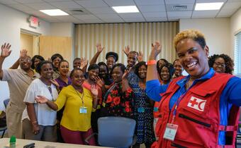 Volunteers from the Bahamas Red Cross receive training in how to provide psychosocial support from an IFRC delegate