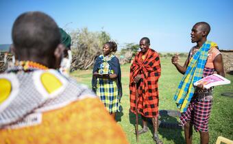 Volunteers from the Kenyan Red Cross deliver a community awareness session