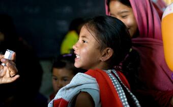 A young girl in Nepal receives a measles vaccine from the Nepal Red Cross in Kathmandu as part of a country-wide measles immunization campaign in 2008 targeting 4 million children aged 9 months to 5 years old