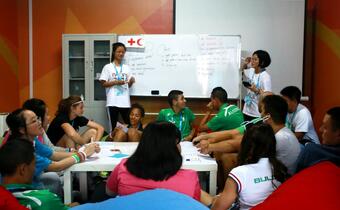 The IFRC and Red Cross Society of China lead educational workshops in the Youth Olympic Village during the 2014 Youth Olympic Games in Nanjing