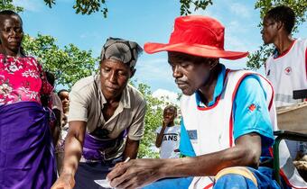 Communities in Siakobvu region, Zimbabwe get registered at a food distribution site run by the Zimbabwe Red Cross in March 2020. The initiative is supported by the Finnish Red Cross, Danish Red Cross and the European Union. 