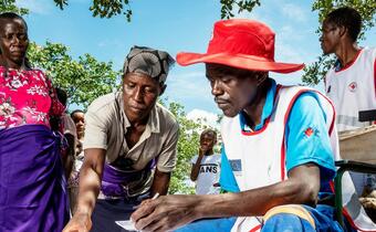 Communities in Siakobvu region, Zimbabwe get registered at a food distribution site run by the Zimbabwe Red Cross in March 2020. The initiative is supported by the Finnish Red Cross, Danish Red Cross and the European Union.