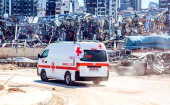 A Lebanese Red Cross ambulance races to the scene of the Beirut blast in August 2020 to provide life-saving medical services to people affected.
