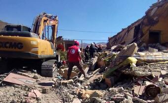 A Moroccan Red Crescent volunteer assists with search and rescue activities following a devastating 6.8 magnitude earthquake that struck the country on 8 September 2023.