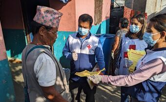 Nepal Red Cross volunteers engage community members in Pokhara in dengue fever prevention activities, sharing valuable information on environmental cleanliness to eliminate mosquito breeding grounds and personal protective measures so families can stay safe.