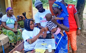 A baby boy receives a dose of a 5-in-1 combination vaccine to protect him from diphtheria, tetanus, whooping cough, hepatitis B and Haemophilus influenzae type B at a vaccination outreach event in Selingue.