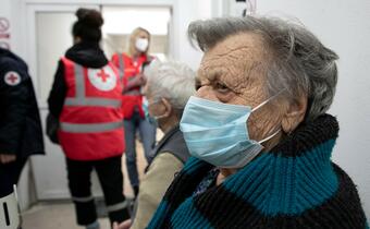 Glina, Croatia, 2 January 2021.86-year-old Balen Jaga is receiving the COVID-19 vaccine at the emergency shelter in Glina after a 6.4 magnitude earthquake.Red Cross volunteers take good care of me; I 