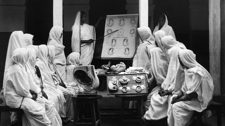 An Indian Red Cross Society volunteer gives nursing lessons to a group of women in 1928