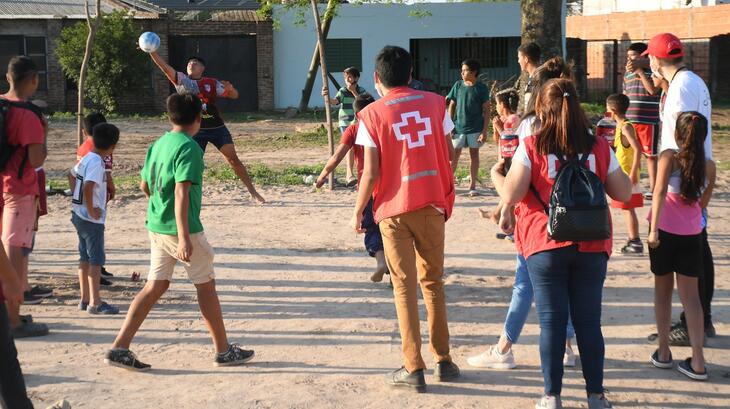 A Red Cross volunteer leads a football game with youth in Argentina as part of the 'Uniting through the power of football' project with Generation Amazing