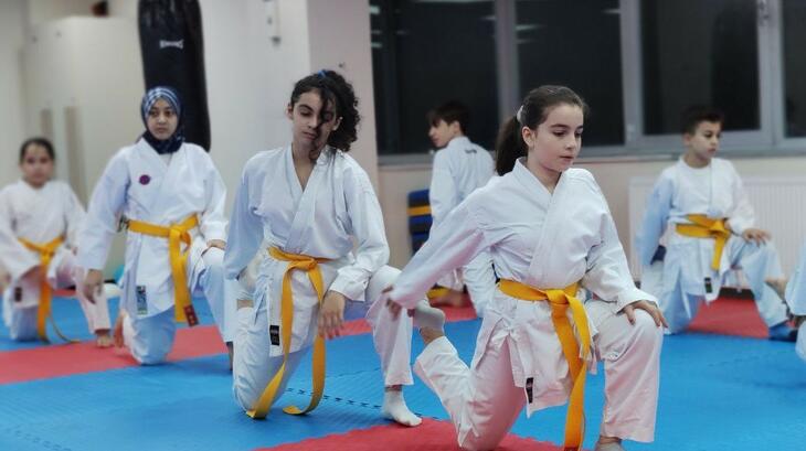 A shot of children taking part in a martial arts class, by ESSN Storyteller, Asmaa. Asmaa says: "I am interested in the field of social development and am a mother of three girls at the same time. If we are to strengthen girls and women by scientific and intellectual power, we also must be empowered by physical strength as well. This is what encouraged me to teach my daughters the martial arts and self-defense. This gives them greater self-confidence, physical fitness, and safety feelings."